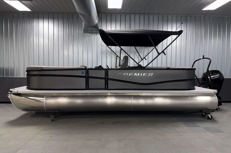 Slide: The Image of 2026 Premier 220 Sunscape RF pontoon boat in a showroom with a sleek design. - 3