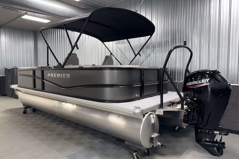 Slide: The Image of 2026 Premier 220 Sunscape RF pontoon boat with Mercury outboard motor in a showroom. - 4