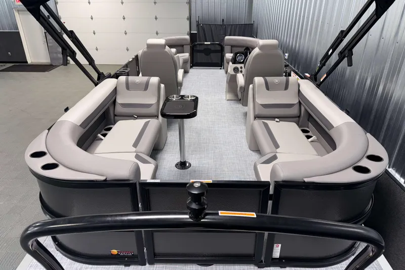 Slide: The Image of 2026 Premier 220 Sunscape RF pontoon boat interior with luxurious seating and modern design. - 7