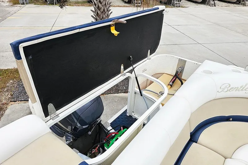Slide: The Image of 2004 Bentley Pontoons 240 Fish boat interior with open engine compartment. - 11