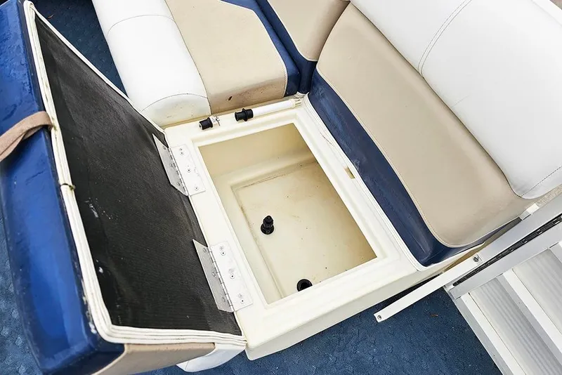 Slide: The Image of Open storage compartment on 2004 Bentley Pontoons 240 Fish boat with cushioned seating. - 14