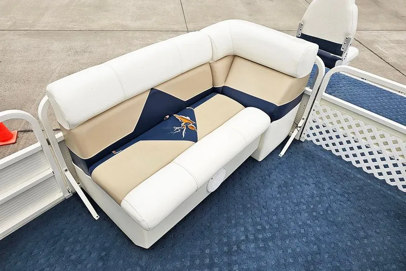 Slide: The Image of 2004 Bentley Pontoons 240 Fish boat seating with beige and blue upholstery. - 15