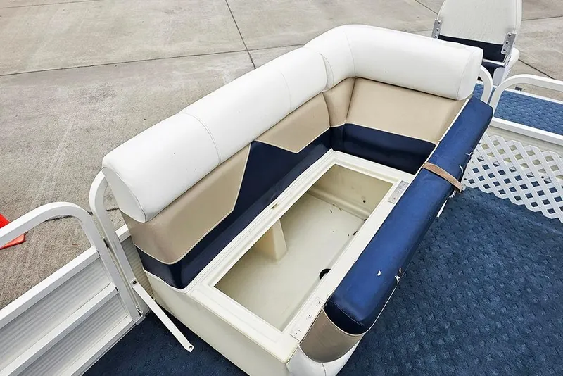 Slide: The Image of 2004 Bentley Pontoons 240 Fish boat seating with storage compartment, featuring blue and beige upholstery. - 16