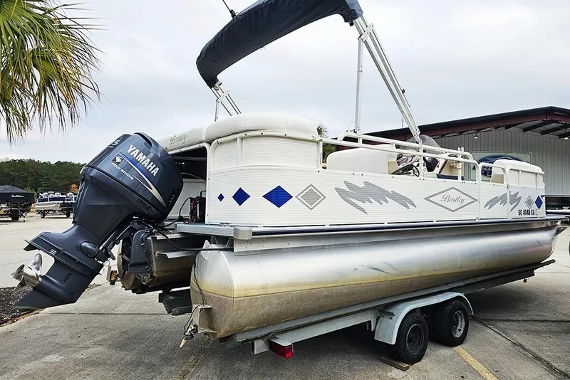 Slide: The Image of 2004 Bentley Pontoons 240 Fish on trailer with Yamaha outboard motor. - 4