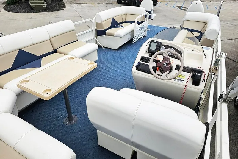 Slide: The Image of 2004 Bentley Pontoons 240 Fish interior with seating, table, and steering console. - 8