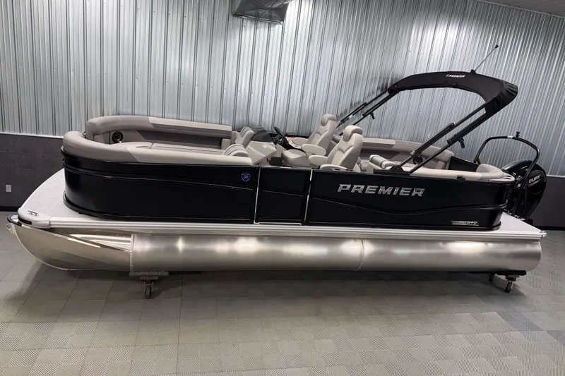 Slide: The Image of 2026 Premier 220 Sunscape RF Tritoon boat in showroom, featuring sleek design and comfortable seating. - 0