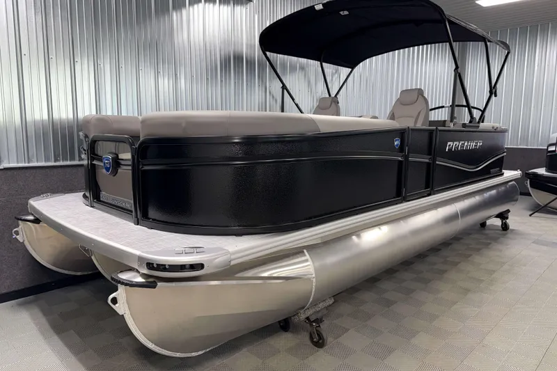 Slide: The Image of 2026 Premier 220 Sunscape RF Tritoon boat in showroom, featuring sleek design and modern amenities. - 1