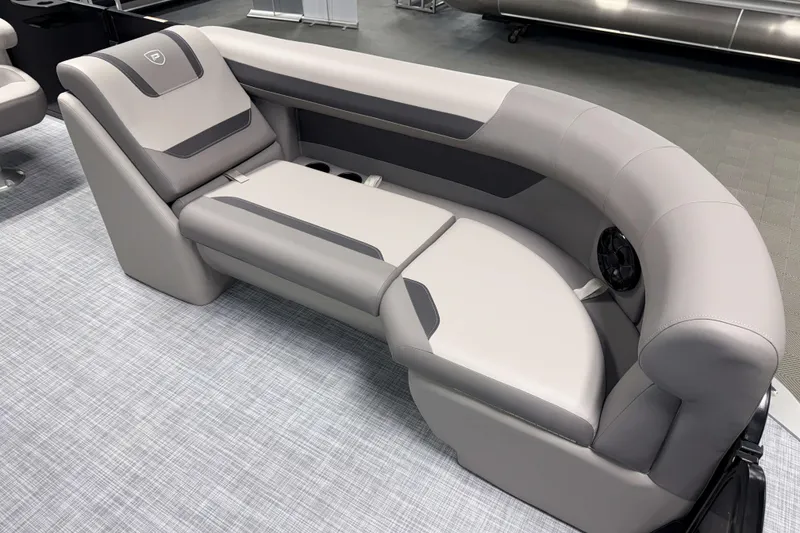 Slide: The Image of Luxurious seating on 2026 Premier 220 Sunscape RF Tritoon, featuring sleek gray upholstery. - 16