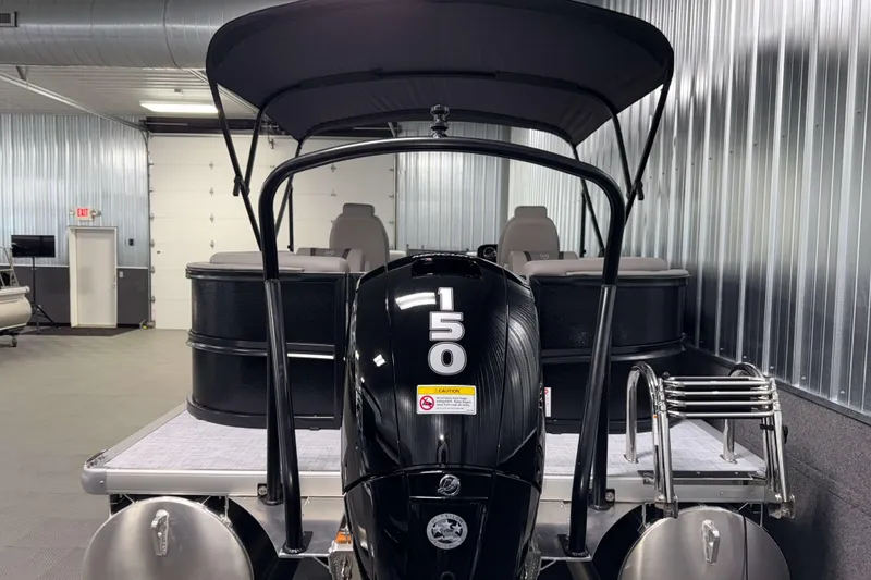 Slide: The Image of 2026 Premier 220 Sunscape RF Tritoon with 150 HP engine in a showroom. - 6