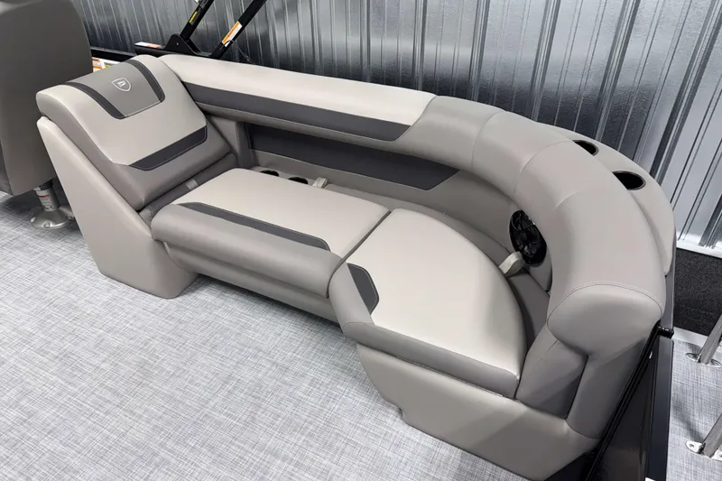 Slide: The Image of 2026 Premier 220 Sunscape RF Tritoon interior seating with gray upholstery and cup holders. - 9