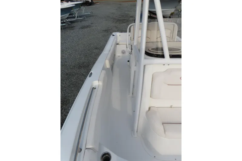 Slide: The Image of 2019 Sea Hunt Ultra 234 boat interior with seating and railing. - 15