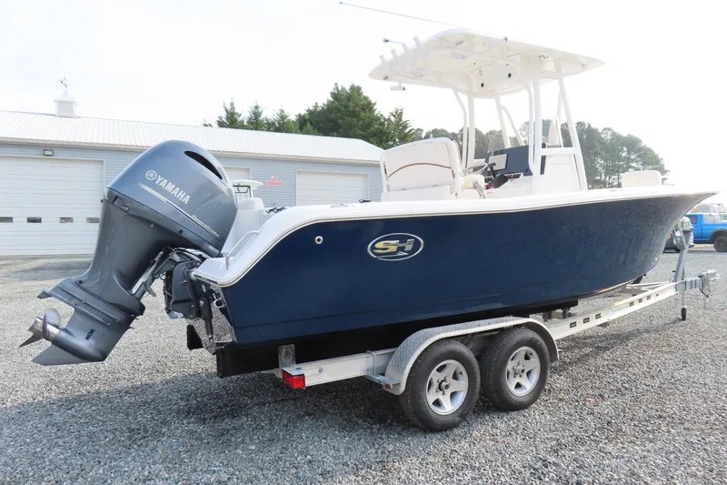 Slide: The Image of 2019 Sea Hunt Ultra 234 boat on trailer with Yamaha outboard motor. - 2