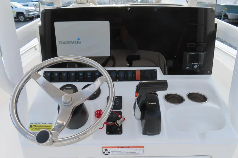 Slide: The Image of 2019 Sea Hunt Ultra 234 boat dashboard with Garmin display and Yamaha controls. - 24