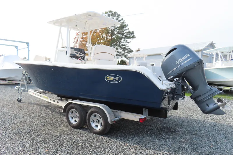 Slide: The Image of 2019 Sea Hunt Ultra 234 boat with Yamaha outboard motor on trailer. - 3