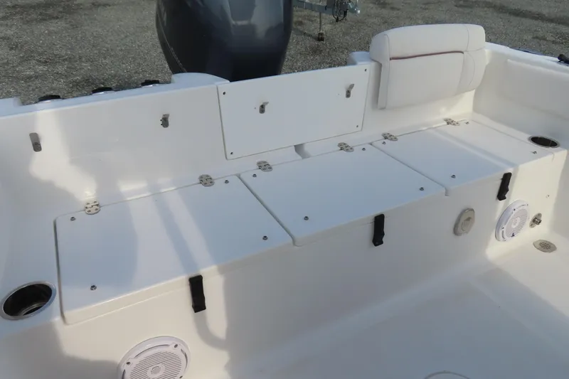 Slide: The Image of 2019 Sea Hunt Ultra 234 boat interior with seating and storage compartments. - 34