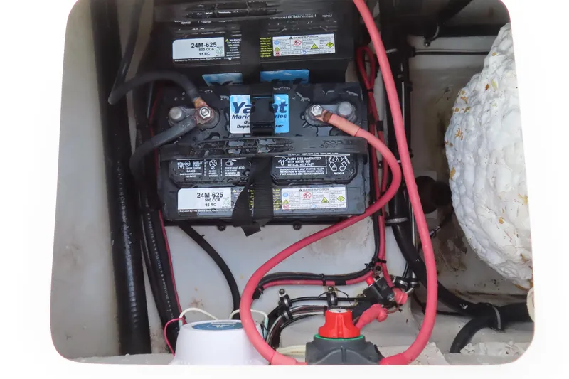 Slide: The Image of Battery compartment of 2019 Sea Hunt Ultra 234 boat with wiring and connections. - 36