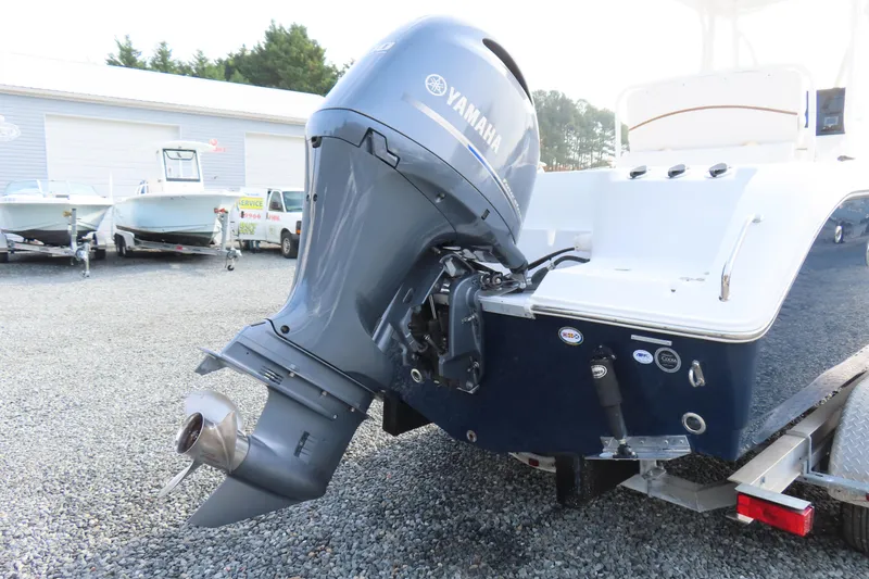 Slide: The Image of 2019 Sea Hunt Ultra 234 boat with Yamaha outboard motor on trailer. - 5