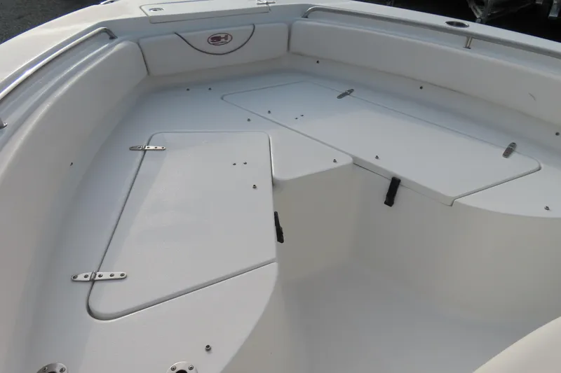 Slide: The Image of 2019 Sea Hunt Ultra 234 boat interior with storage compartments. - 8