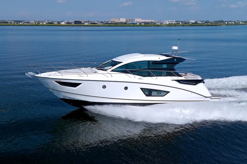 Slide: The Image of 2019 Beneteau Gran Turismo 50 yacht cruising on calm blue waters. - 10