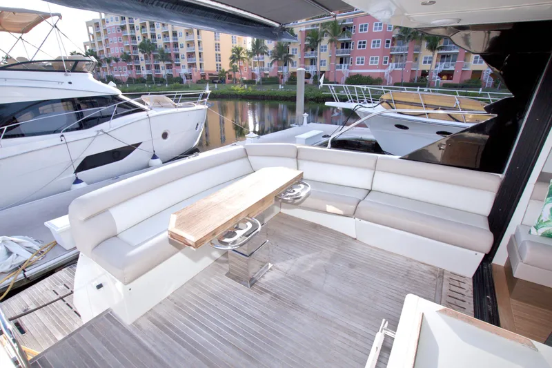 Slide: The Image of Luxurious 2019 Beneteau Gran Turismo 50 yacht with spacious outdoor seating area. - 14