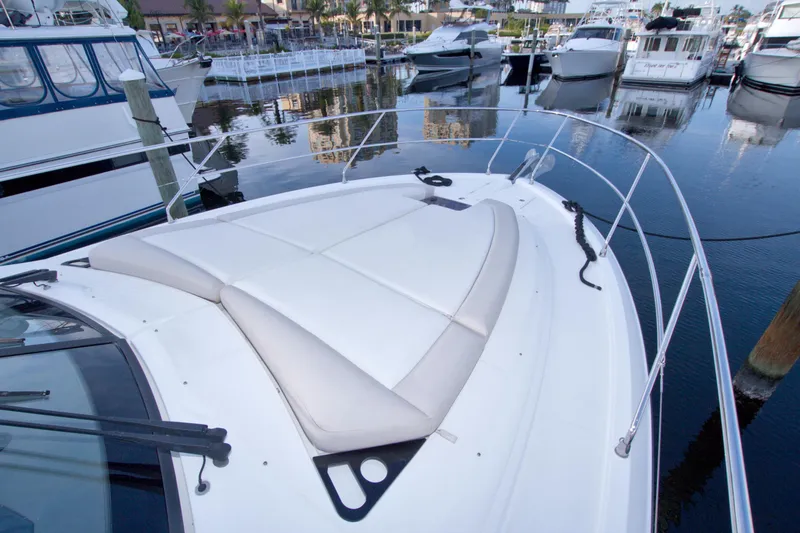 Slide: The Image of 2019 Beneteau Gran Turismo 50 yacht with spacious deck in marina setting. - 20