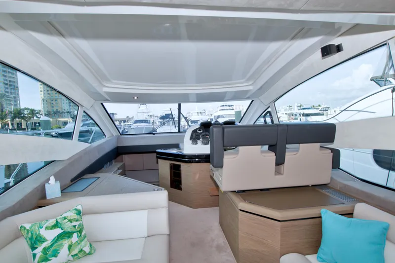 Slide: The Image of Luxurious interior of 2019 Beneteau Gran Turismo 50 yacht with modern seating and panoramic windows. - 35
