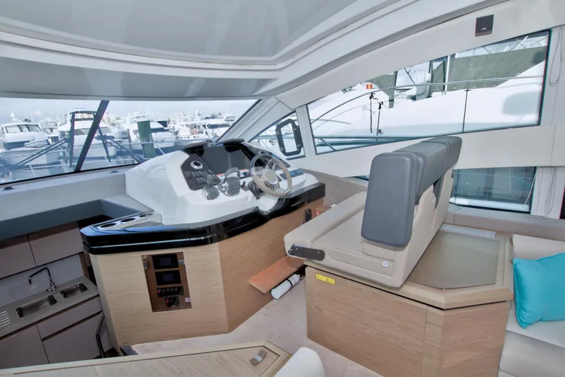 Slide: The Image of 2019 Beneteau Gran Turismo 50 yacht interior with helm, seating, and modern design. - 37