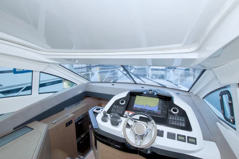 Slide: The Image of 2019 Beneteau Gran Turismo 50 yacht cockpit with modern navigation system and sleek design. - 39