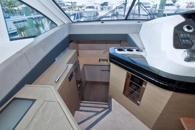 Slide: The Image of 2019 Beneteau Gran Turismo 50 yacht interior with modern kitchen and control panel. - 40
