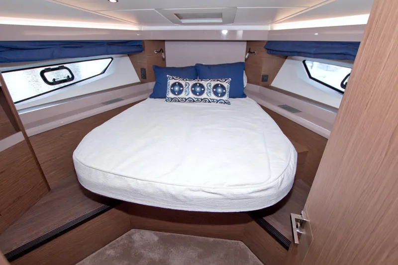 Slide: The Image of Luxurious cabin interior of 2019 Beneteau Gran Turismo 50 yacht with cozy bedding. - 44