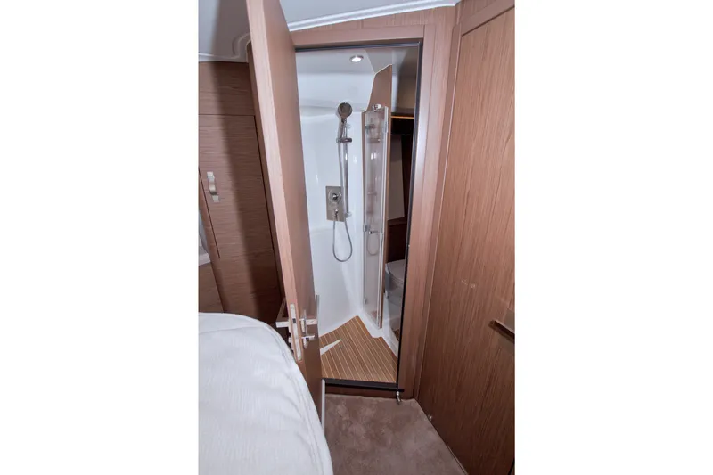 Slide: The Image of 2019 Beneteau Gran Turismo 50 yacht interior with modern shower and wooden accents. - 48