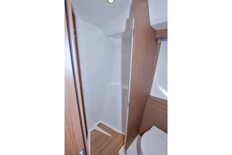 Slide: The Image of 2019 Beneteau Gran Turismo 50 bathroom with wooden accents and modern design. - 53