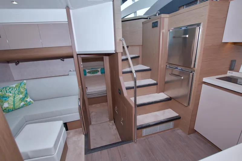 Slide: The Image of Luxurious interior of 2019 Beneteau Gran Turismo 50 yacht with modern kitchen and seating area. - 56