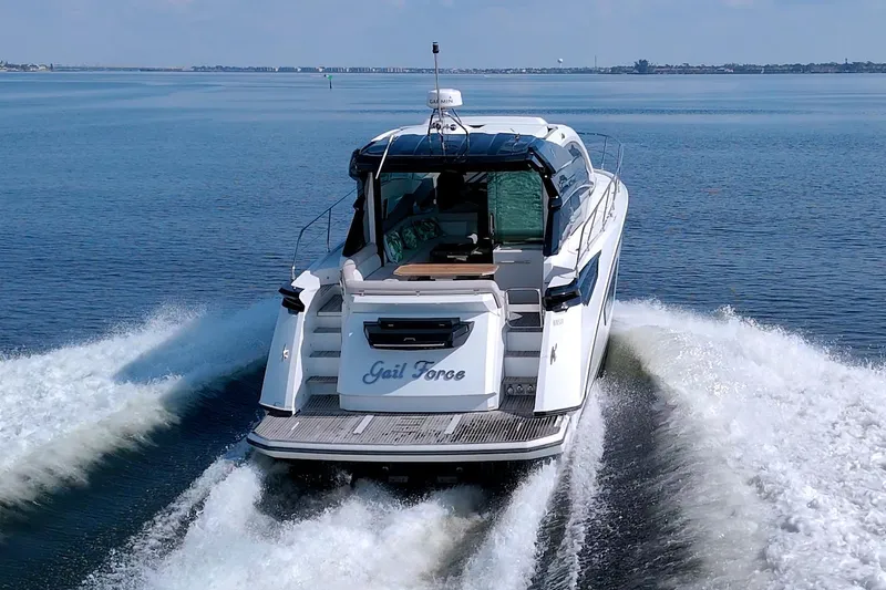 Slide: The Image of 2019 Beneteau Gran Turismo 50 yacht cruising on open water, rear view. - 6