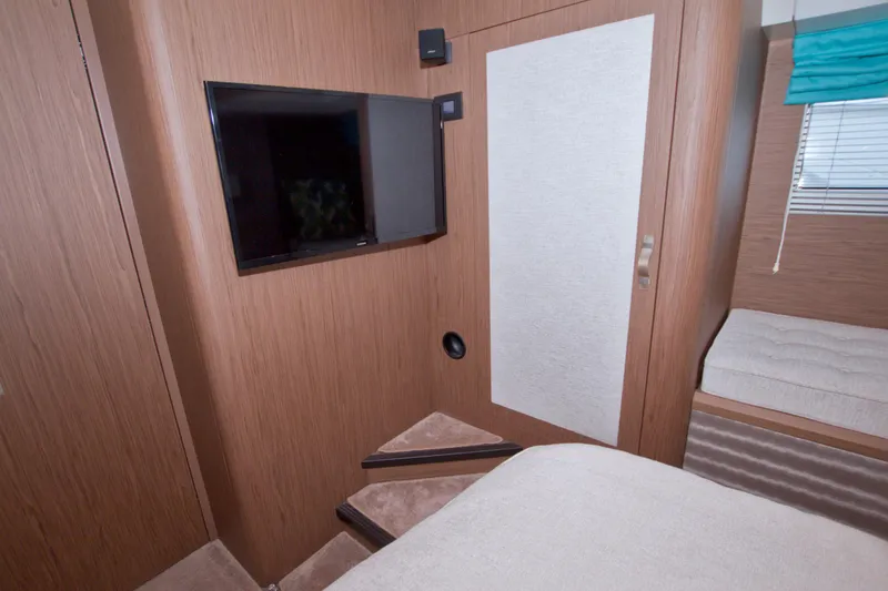 Slide: The Image of Interior of 2019 Beneteau Gran Turismo 50 yacht with TV and modern furnishings. - 62