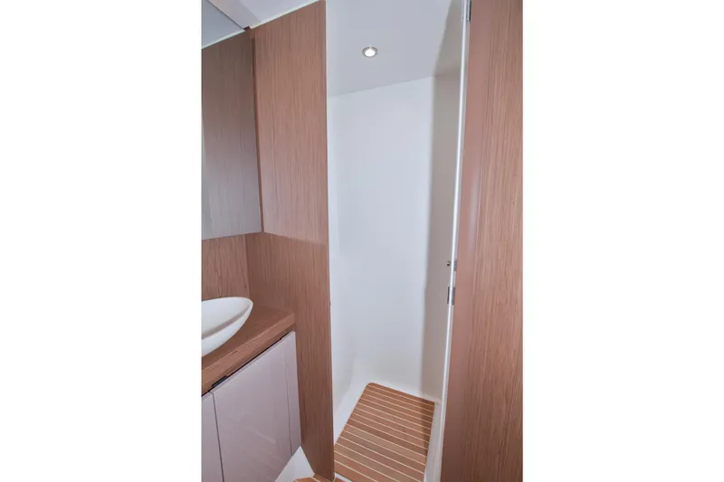 Slide: The Image of 2019 Beneteau Gran Turismo 50 bathroom with modern wood finish and sleek design. - 69