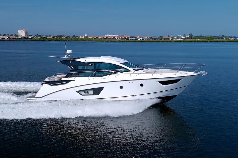 Slide: The Image of 2019 Beneteau Gran Turismo 50 yacht cruising on calm waters, showcasing sleek design. - 7
