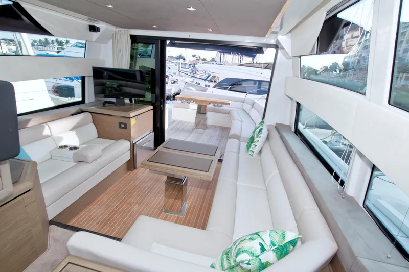 Slide: The Image of Luxurious interior of 2019 Beneteau Gran Turismo 50 yacht with modern seating and large windows. - 70