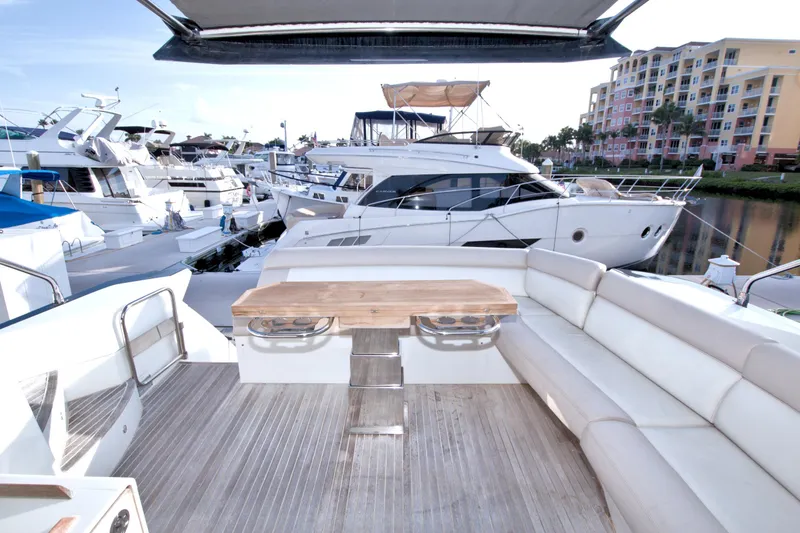 Slide: The Image of Luxurious 2019 Beneteau Gran Turismo 50 yacht docked, featuring spacious seating and elegant design. - 71