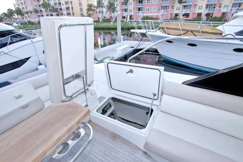 Slide: The Image of 2019 Beneteau Gran Turismo 50 yacht interior with open storage compartments and seating area. - 72