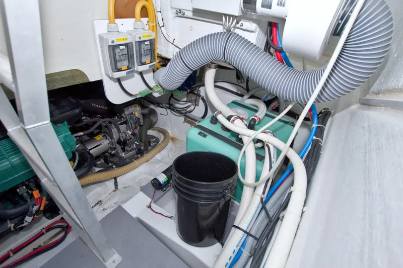 Slide: The Image of Engine room of 2019 Beneteau Gran Turismo 50 with mechanical components and wiring. - 73