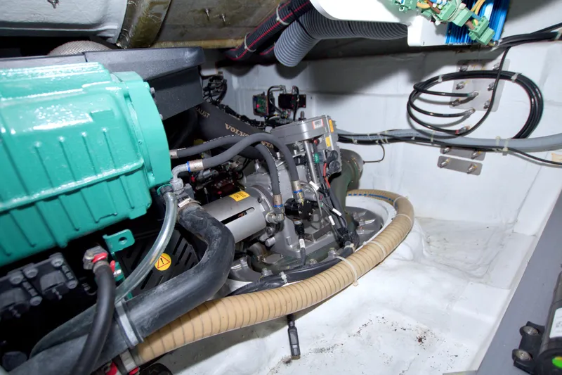 Slide: The Image of Engine room of 2019 Beneteau Gran Turismo 50 yacht, showcasing mechanical components. - 74