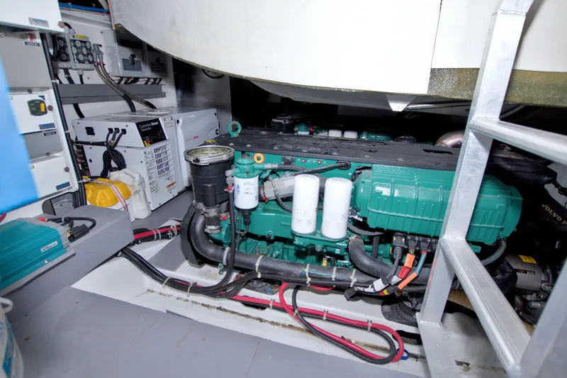 Slide: The Image of Engine room of 2019 Beneteau Gran Turismo 50 yacht, featuring Cummins generator and Volvo Penta engine. - 77