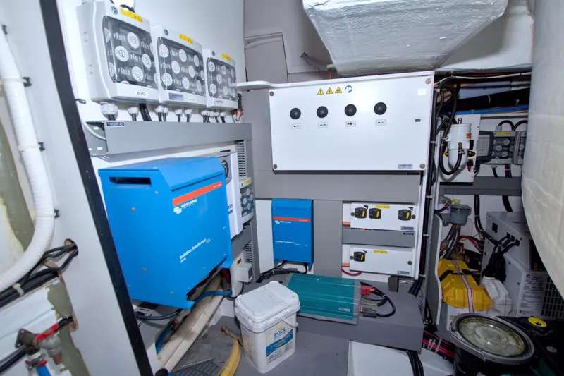 Slide: The Image of Engine room of 2019 Beneteau Gran Turismo 50 with electrical systems and equipment. - 79