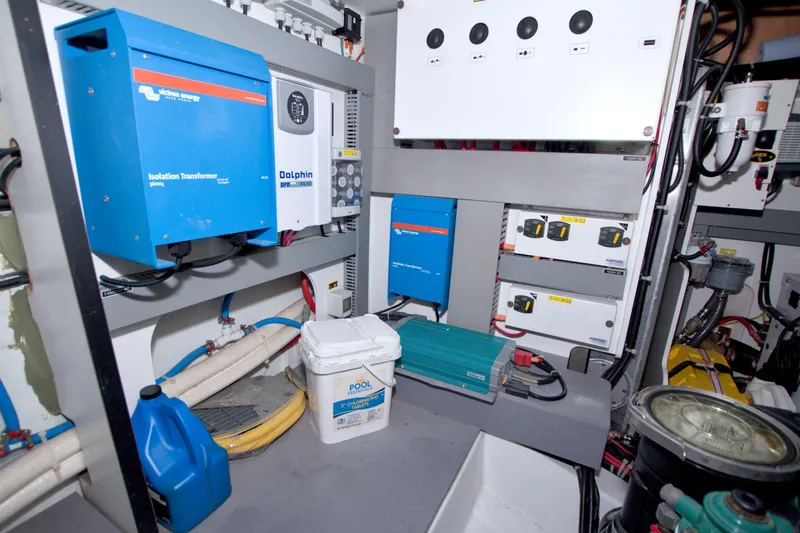 Slide: The Image of Electrical system of a 2019 Beneteau Gran Turismo 50 yacht, featuring transformers and control panels. - 80