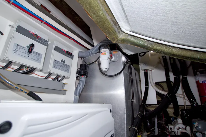 Slide: The Image of Engine room of 2019 Beneteau Gran Turismo 50 yacht, showcasing electrical systems and components. - 84