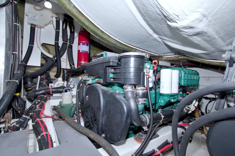 Slide: The Image of Engine room of 2019 Beneteau Gran Turismo 50 yacht, showcasing mechanical components and wiring. - 87