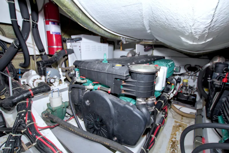 Slide: The Image of Engine room of 2019 Beneteau Gran Turismo 50 yacht, showcasing mechanical components and systems. - 88