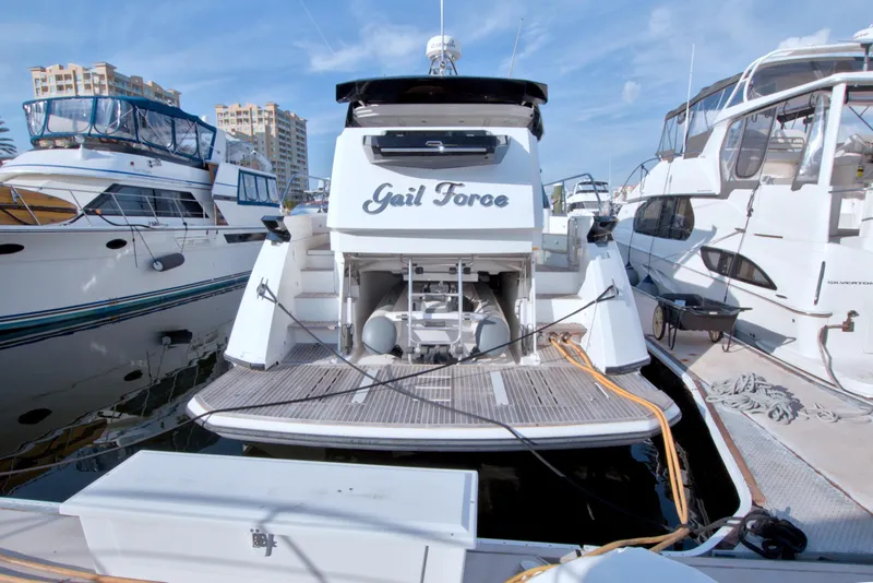 Slide: The Image of 2019 Beneteau Gran Turismo 50 yacht docked at marina, rear view. - 92