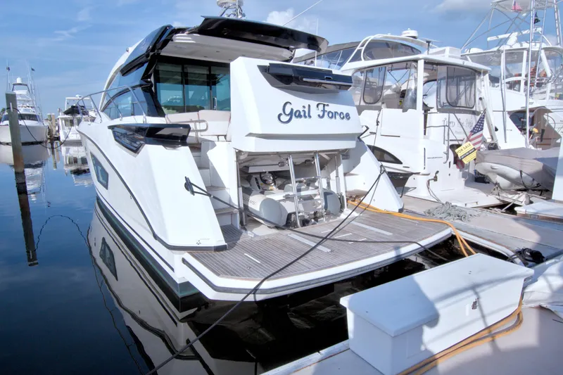 Slide: The Image of 2019 Beneteau Gran Turismo 50 yacht docked at marina, rear view. - 93